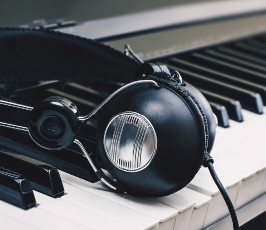 headphones on piano keys